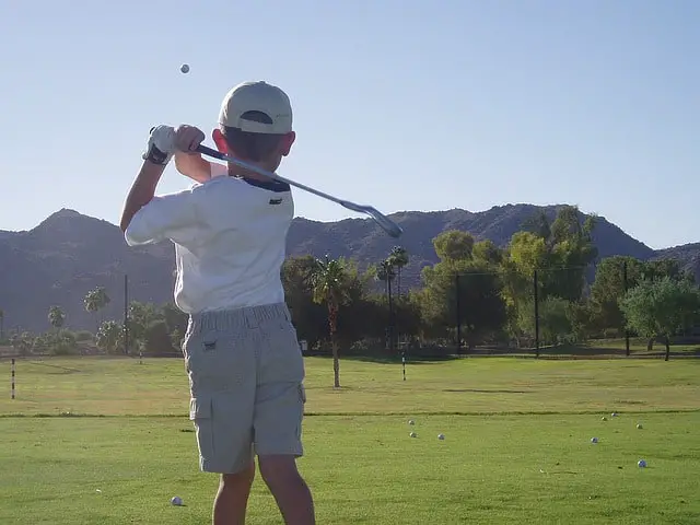 Kid playing golf