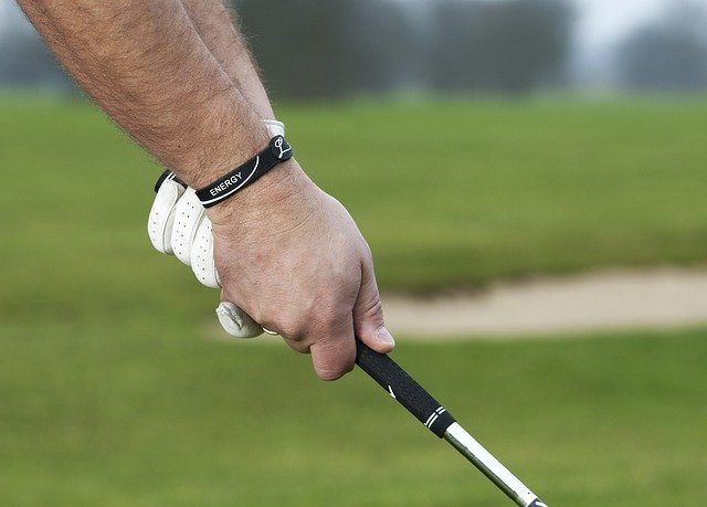 Golfer gripping club