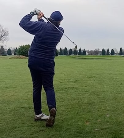 Tom Rothwell hitting 8 iron