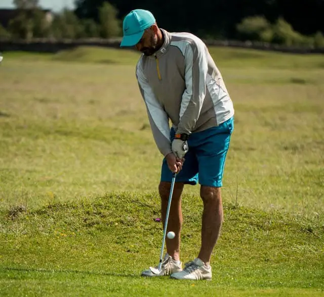 Golfer wearing glove on left hand