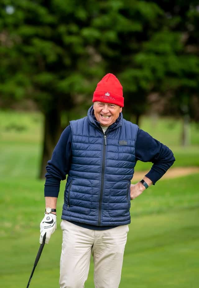 Golfer standing after shot